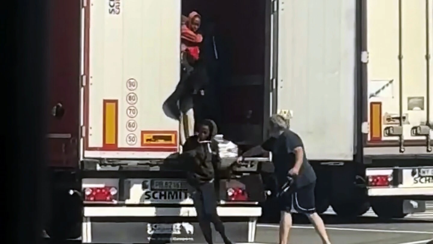 Italian authorities seek truck driver who was filmed striking migrants near French border