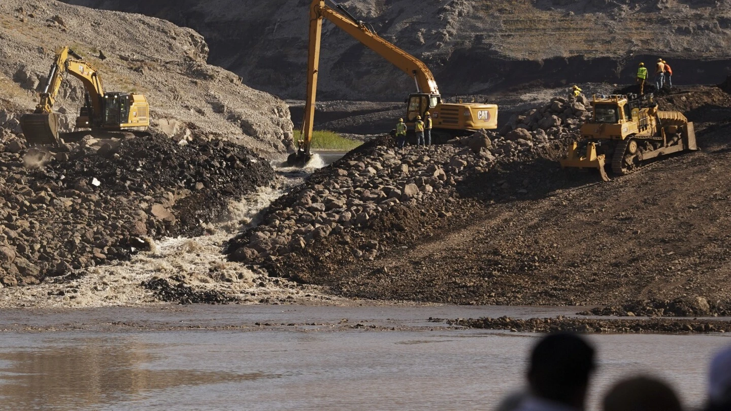 Workers breach key Klamath dams, allowing salmon to swim freely for the first time in a century