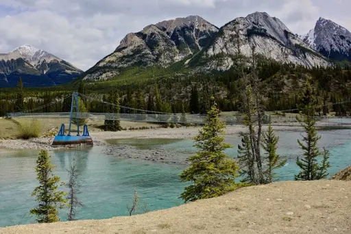 The pedestrian bridge spanning across the North Saskatchwan River.  From left I believe you have Leporidae Peak follwed by Normandy, Ardennes, and Elbe peaks all in the same cluster.