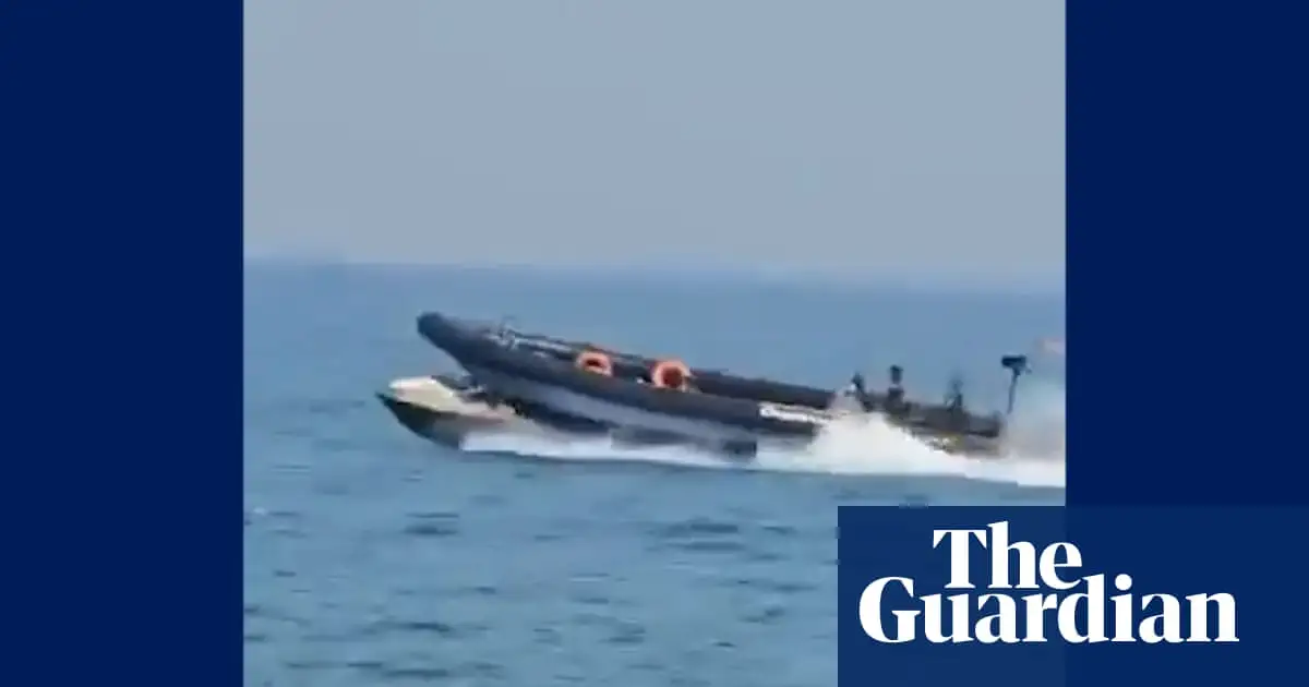 Spanish police boat appears to run over dinghy carrying four people