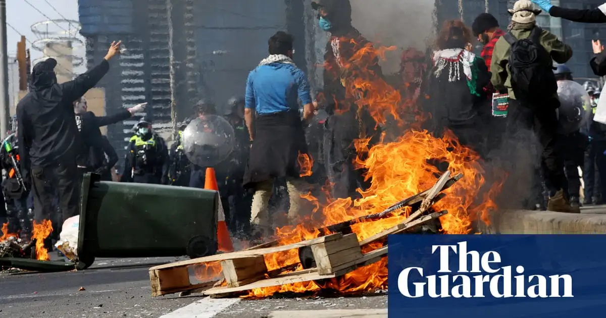 Injuries and arrests in Melbourne as anti-war protesters and police clash in fiery scenes