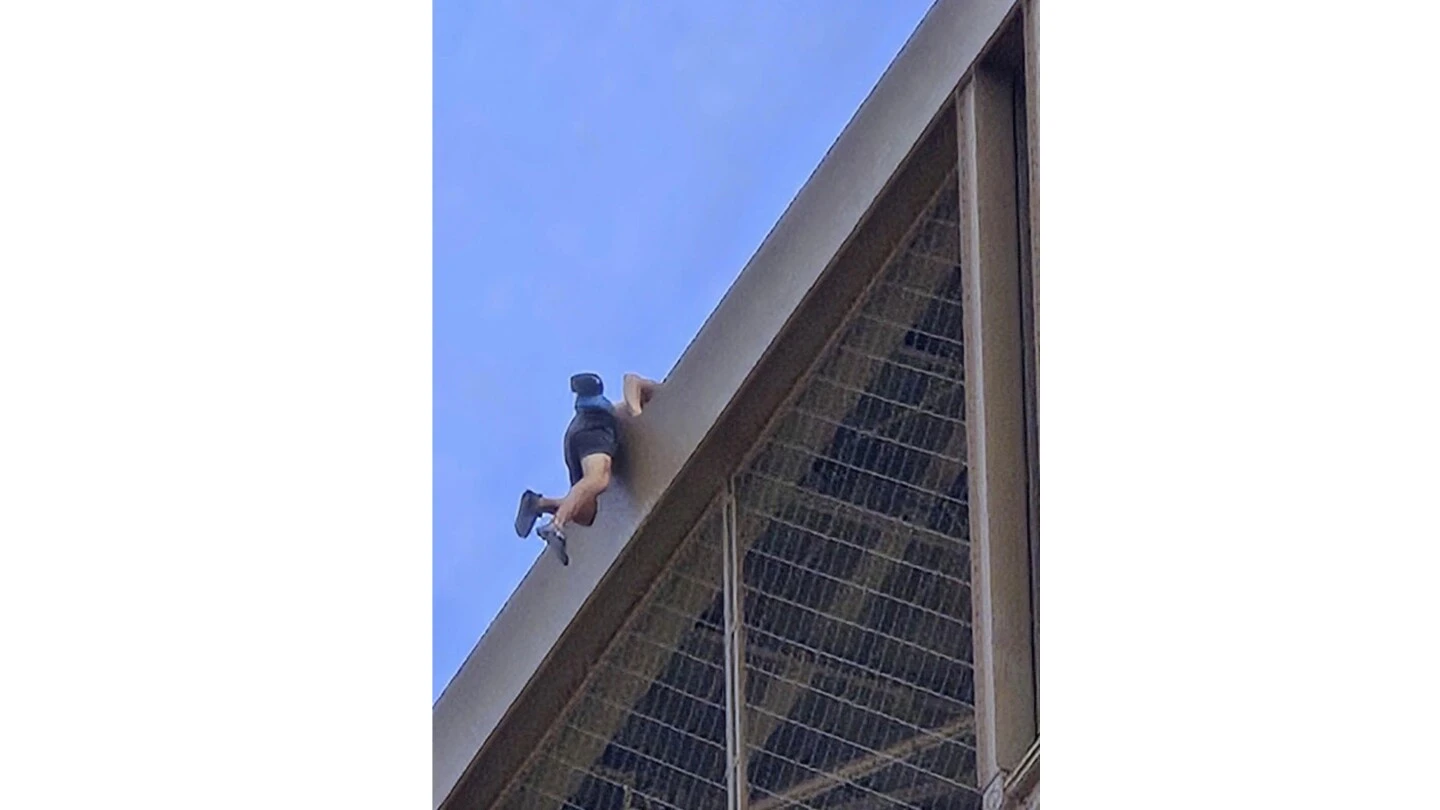 Police arrest a man climbing the Eiffel Tower, prompting an evacuation hours before closing ceremony