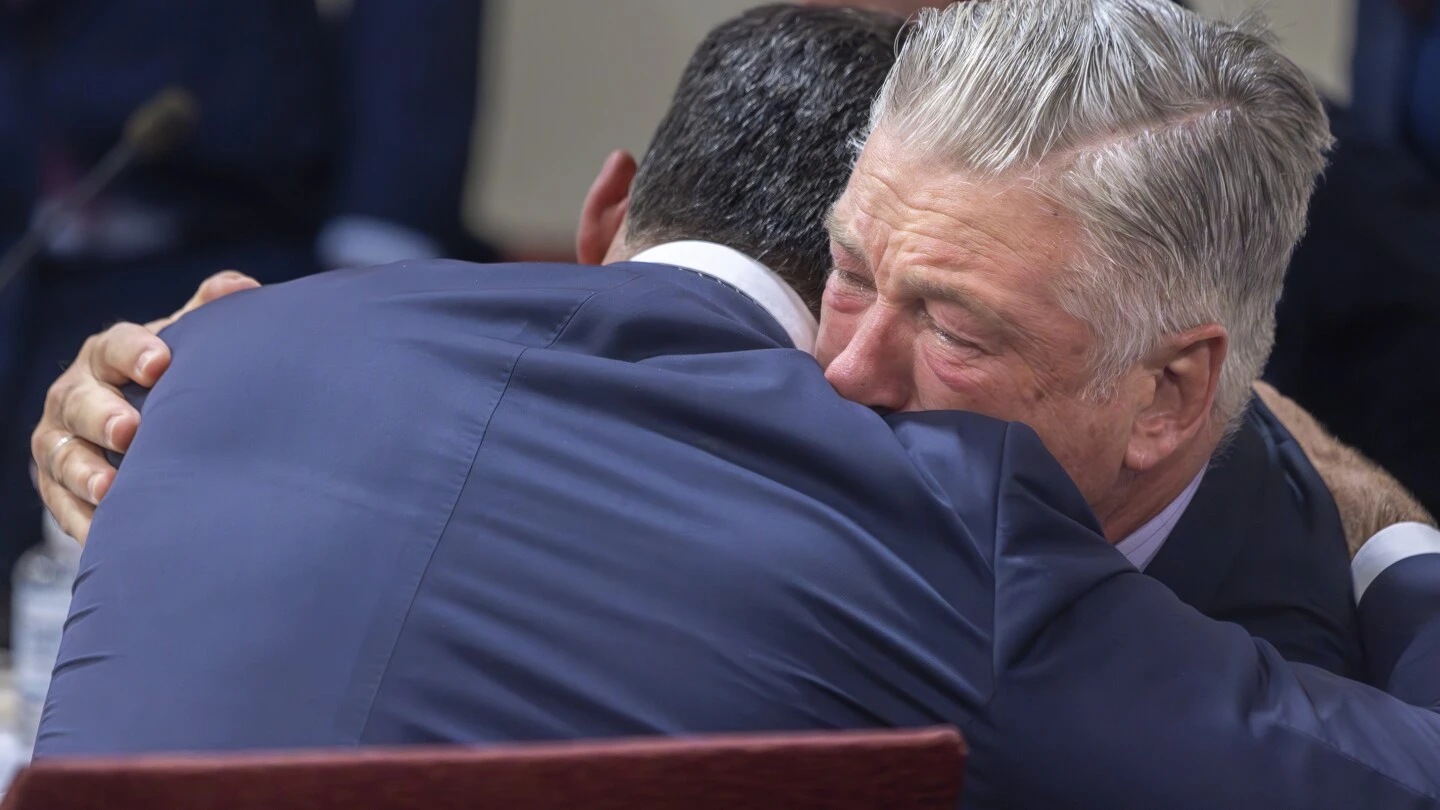 Alec Baldwin weeps in court as judge announces involuntary manslaughter case is dismissed midtrial