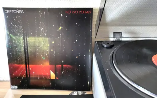 The album cover leans against the wall next to my turntable.