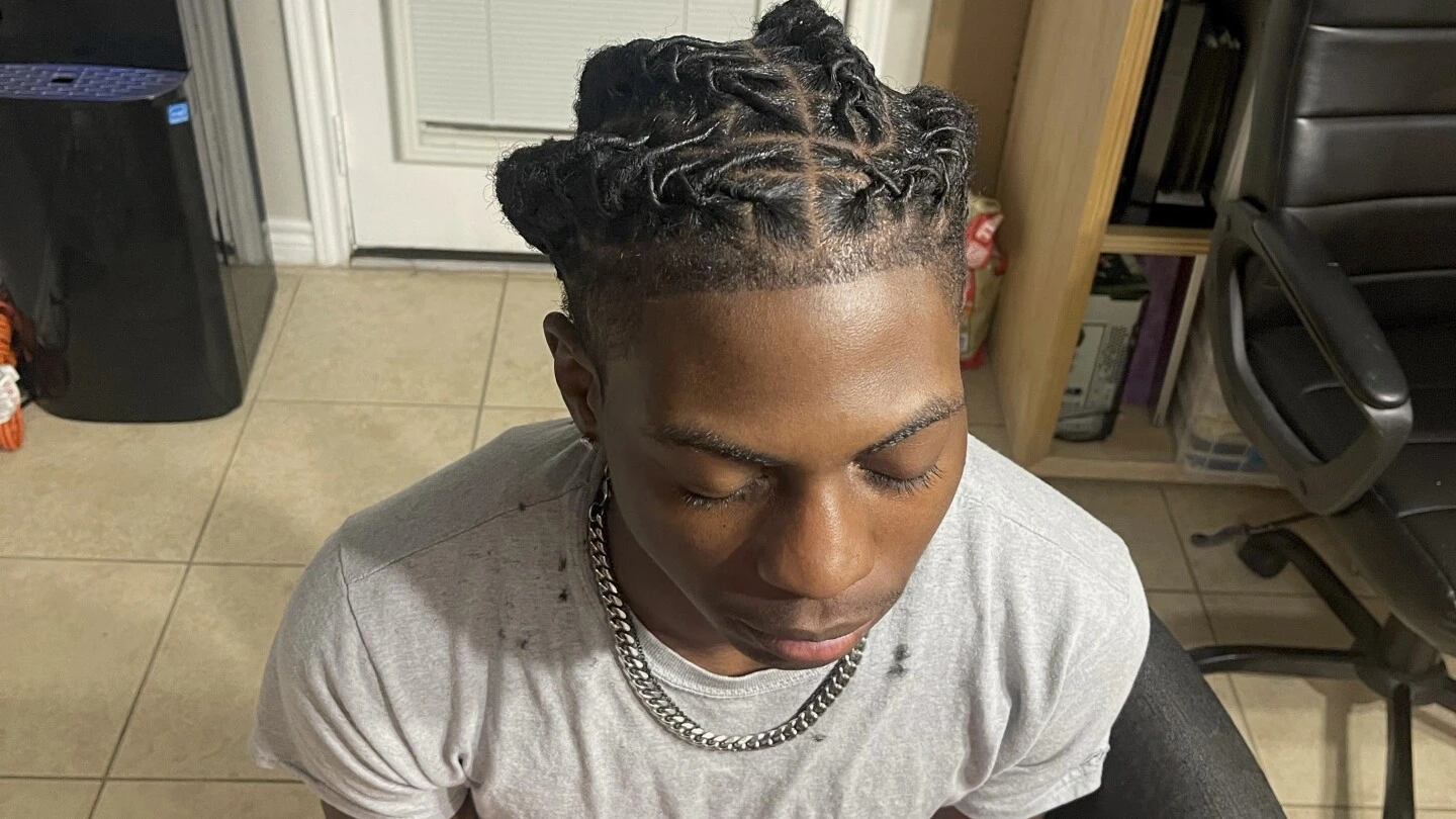 A Black student was suspended for his hairstyle. The school says it wasn't discrimination